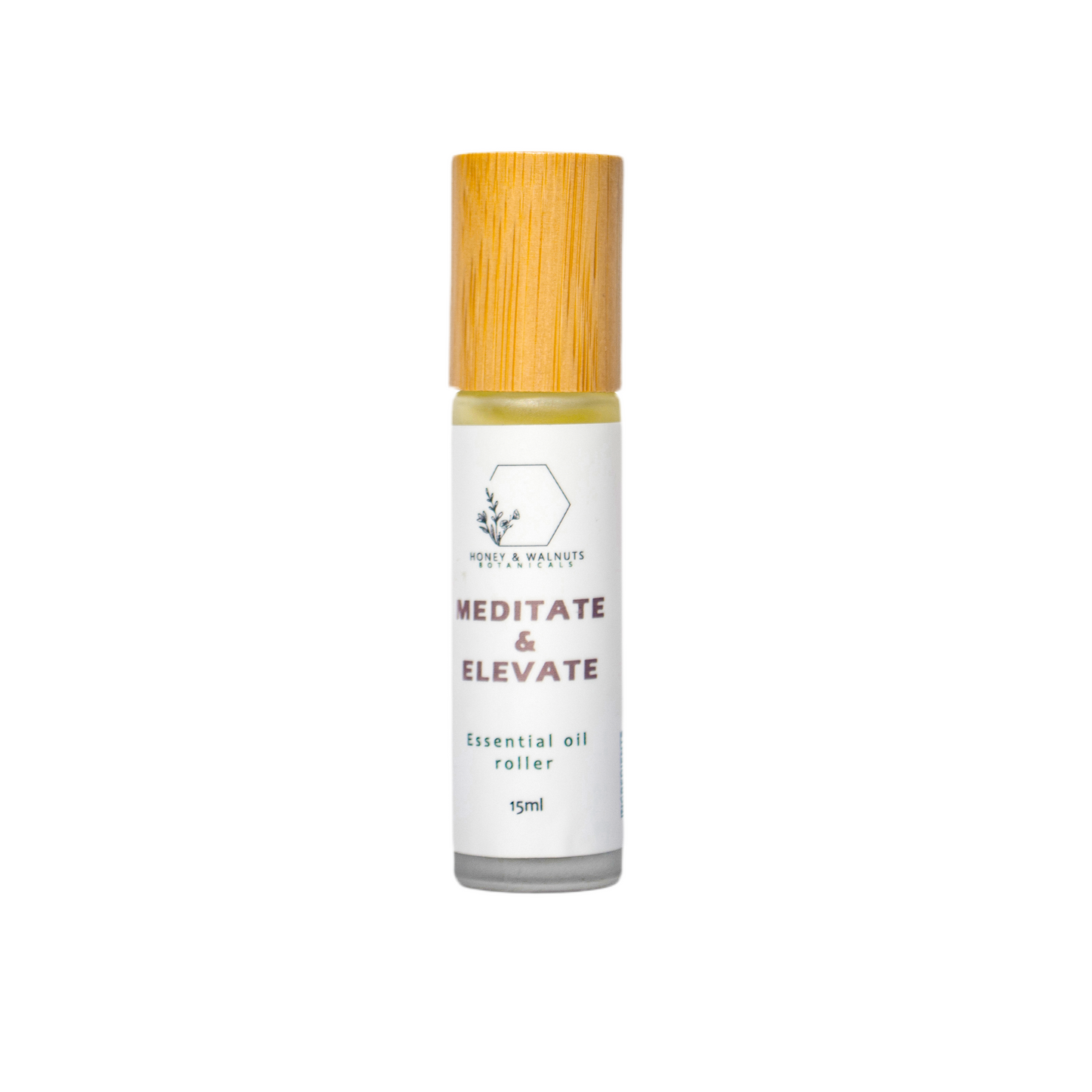 Essential oil roller bottle with wooden cap on a white background